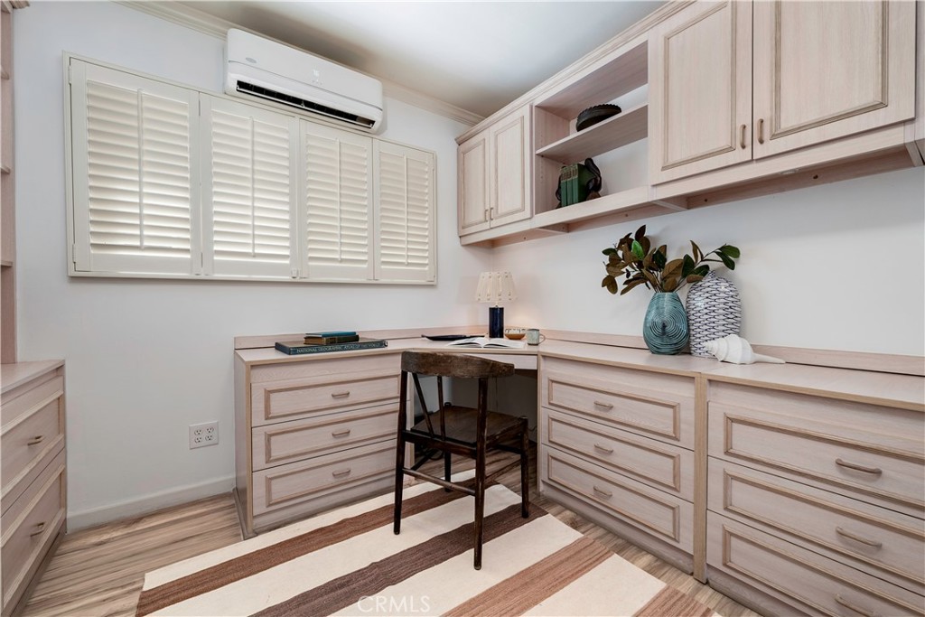 143 Roycroft Avenue Long Beach, CA 90803 - Photo 27 of 45 a kitchen with cabinets appliances and a window