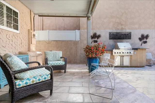 a living room with furniture and flowers
