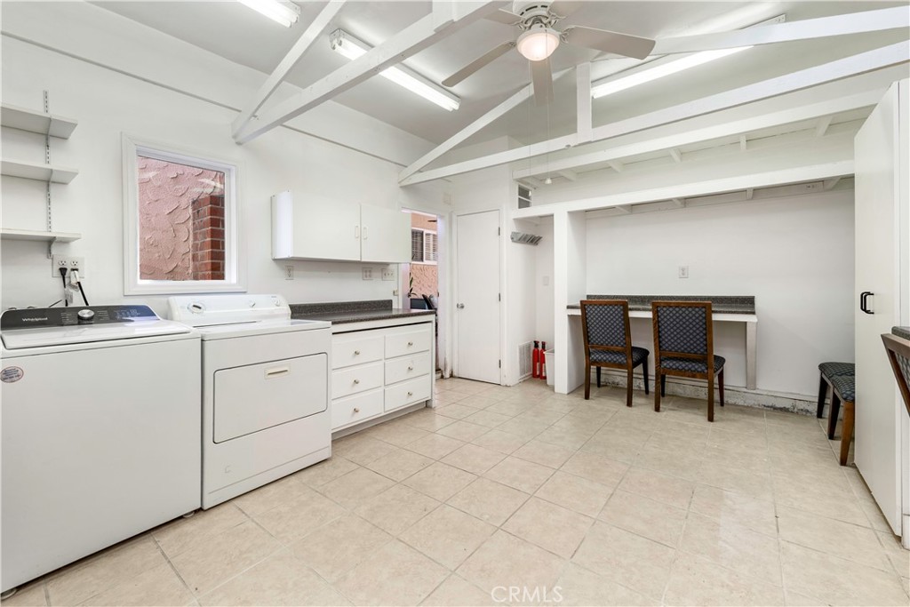 143 Roycroft Avenue Long Beach, CA 90803 - Photo 40 of 45 a kitchen with cabinets and chairs