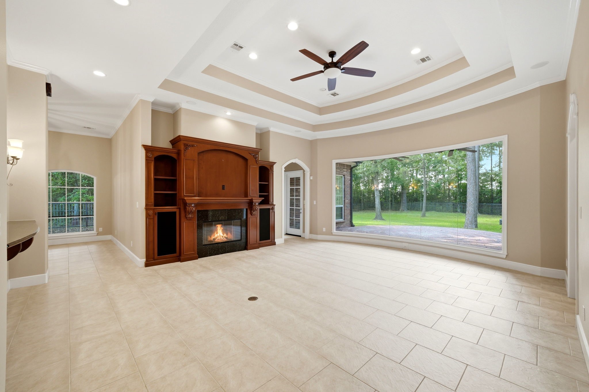3907 North Rondelet Drive Spring, TX 77386 - Photo 11 of 50 family room with built ins and incredible views of backyard