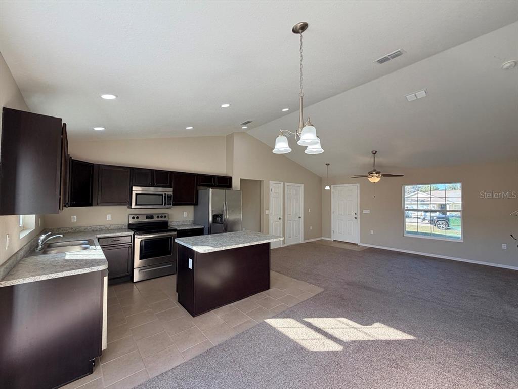 14656 Southwest 21st Place Ocala, FL 34481 - Photo 15 of 52 a view of a kitchen with microwave and cabinets