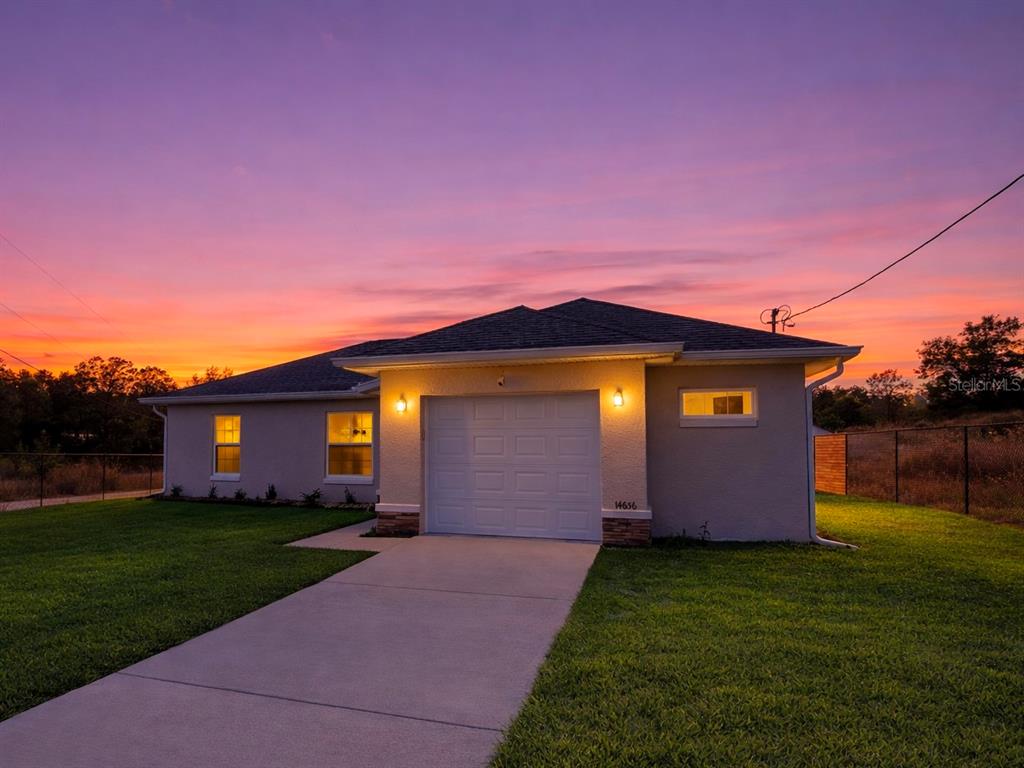 14656 Southwest 21st Place Ocala, FL 34481 - Photo 2 of 52 a front view of house with yard and green space
