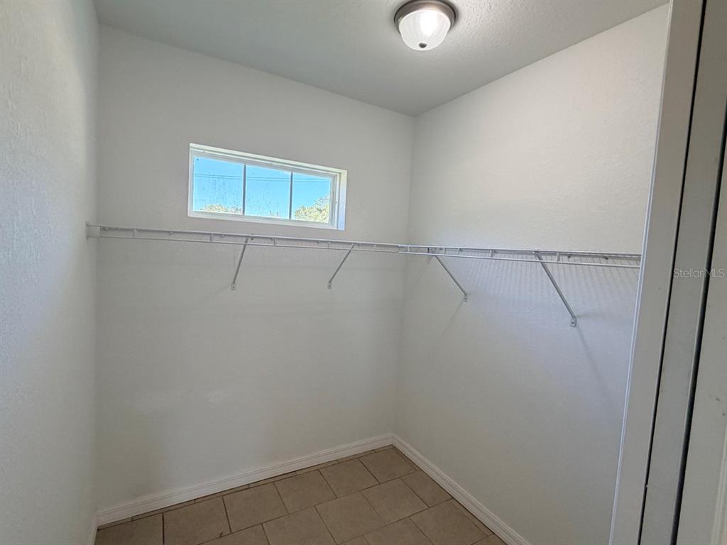 14656 Southwest 21st Place Ocala, FL 34481 - Photo 24 of 52 a view of a room with racks on the wall