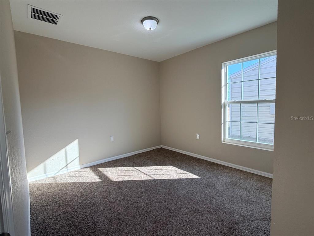 14656 Southwest 21st Place Ocala, FL 34481 - Photo 32 of 52 an empty room with windows