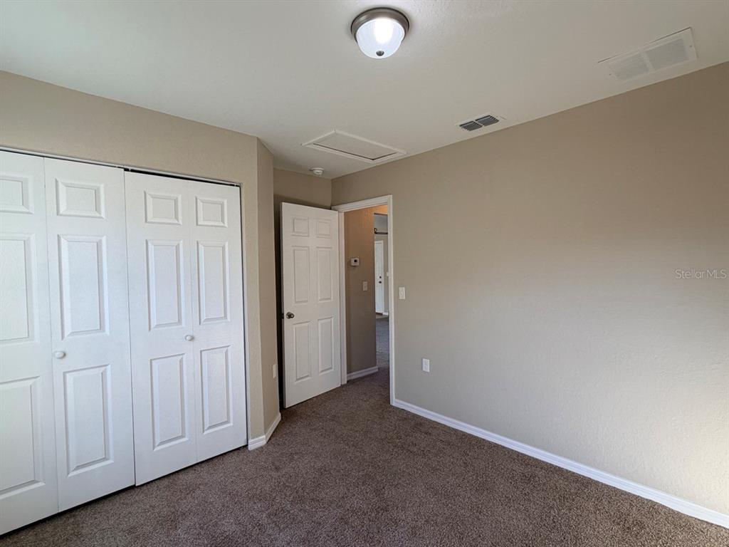 14656 Southwest 21st Place Ocala, FL 34481 - Photo 34 of 52 an empty room with windows