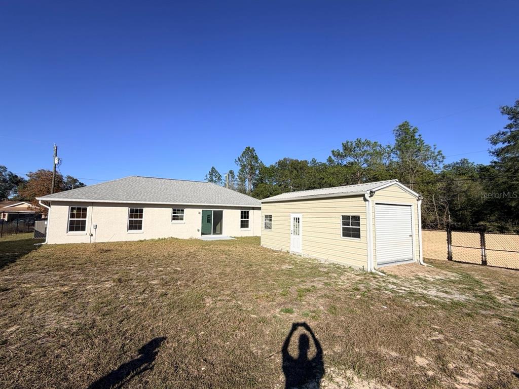 14656 Southwest 21st Place Ocala, FL 34481 - Photo 39 of 52 a view of a house with a backyard
