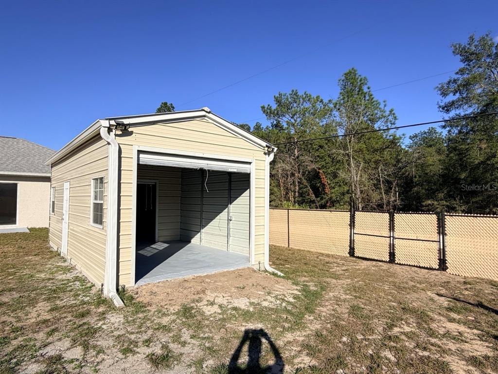 14656 Southwest 21st Place Ocala, FL 34481 - Photo 42 of 52 a view of a house with backyard