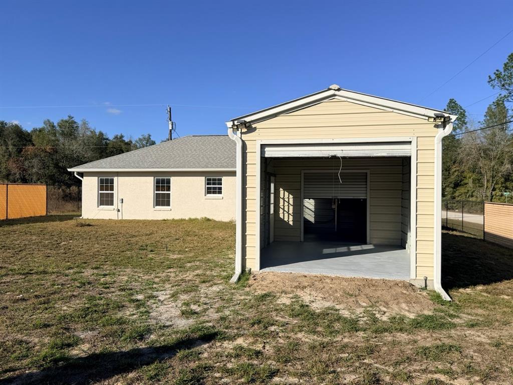 14656 Southwest 21st Place Ocala, FL 34481 - Photo 46 of 52 a view of a house with a patio