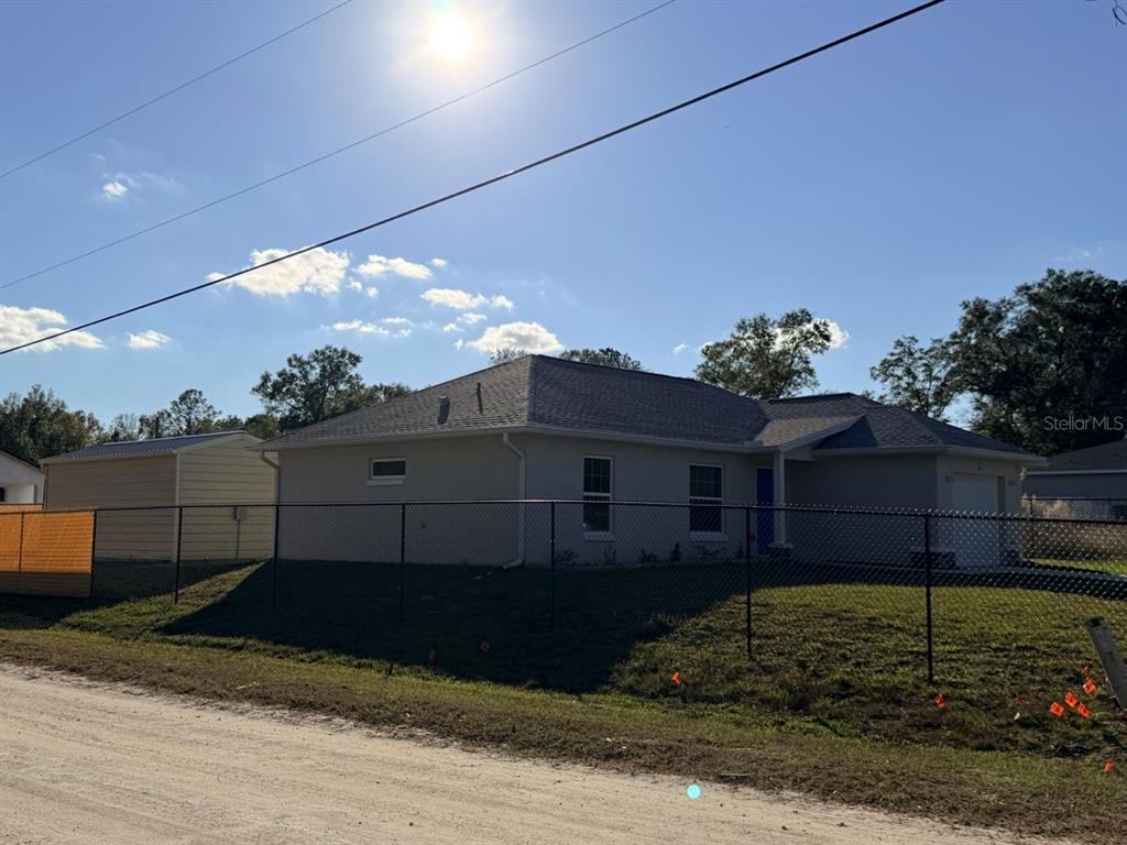 14656 Southwest 21st Place Ocala, FL 34481 - Photo 52 of 52 a view of a house with a yard