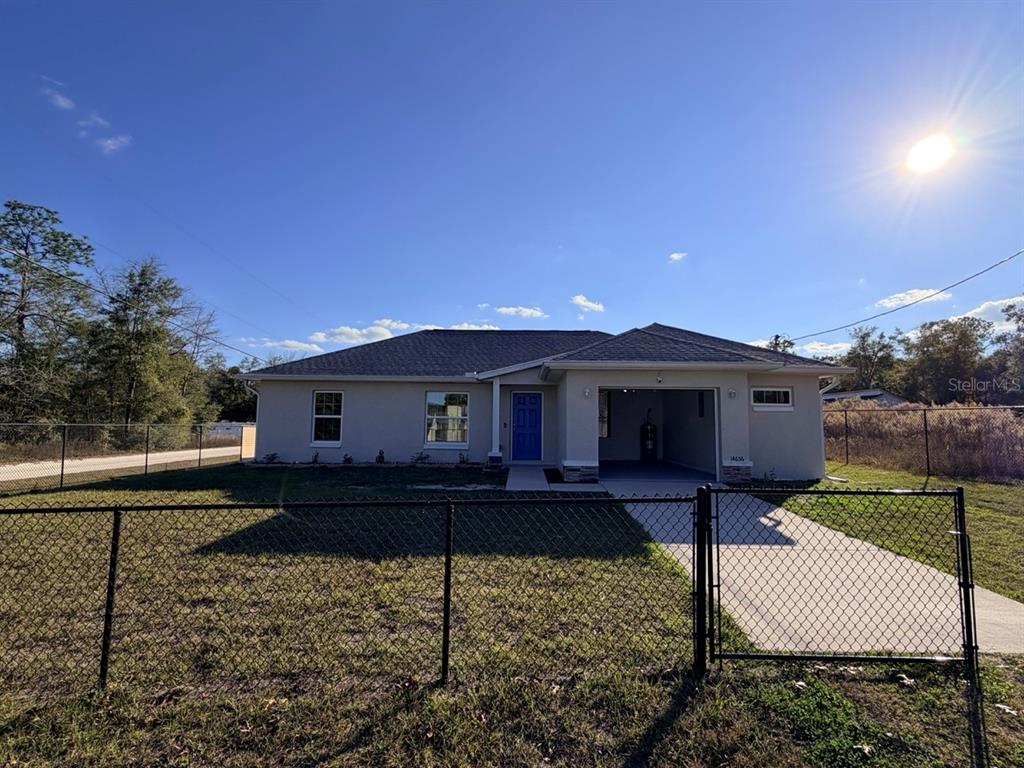 14656 Southwest 21st Place Ocala, FL 34481 - Photo 8 of 52 a front view of a house with garden