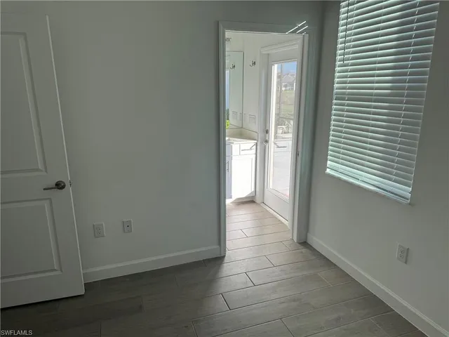 a view of a hallway with a door