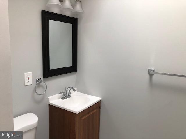 6630 North Broad Street Philadelphia, PA 19126 - Photo 4 of 12 a bathroom with a toilet sink and mirror