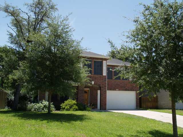 8105 Baxter Springs Road Austin, TX 78745 - Photo 1 of 1 a front view of a house with garden