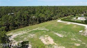 4792 11th Avenue Southwest Naples, FL 34116 - Photo 4 of 8 a view of a field with an outdoor space