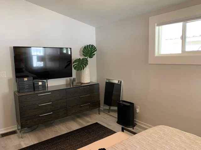 a room with furniture and flat screen tv