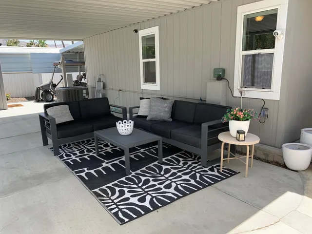 swimming pool view with a outdoor seating