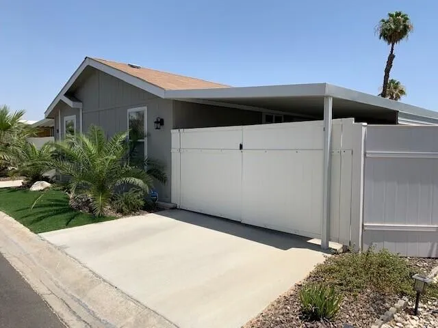 a backyard of a house with lots of green space