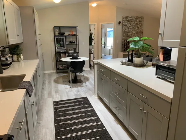 a kitchen with a sink and cabinets