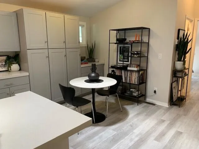 a bedroom with a bed and a table in it