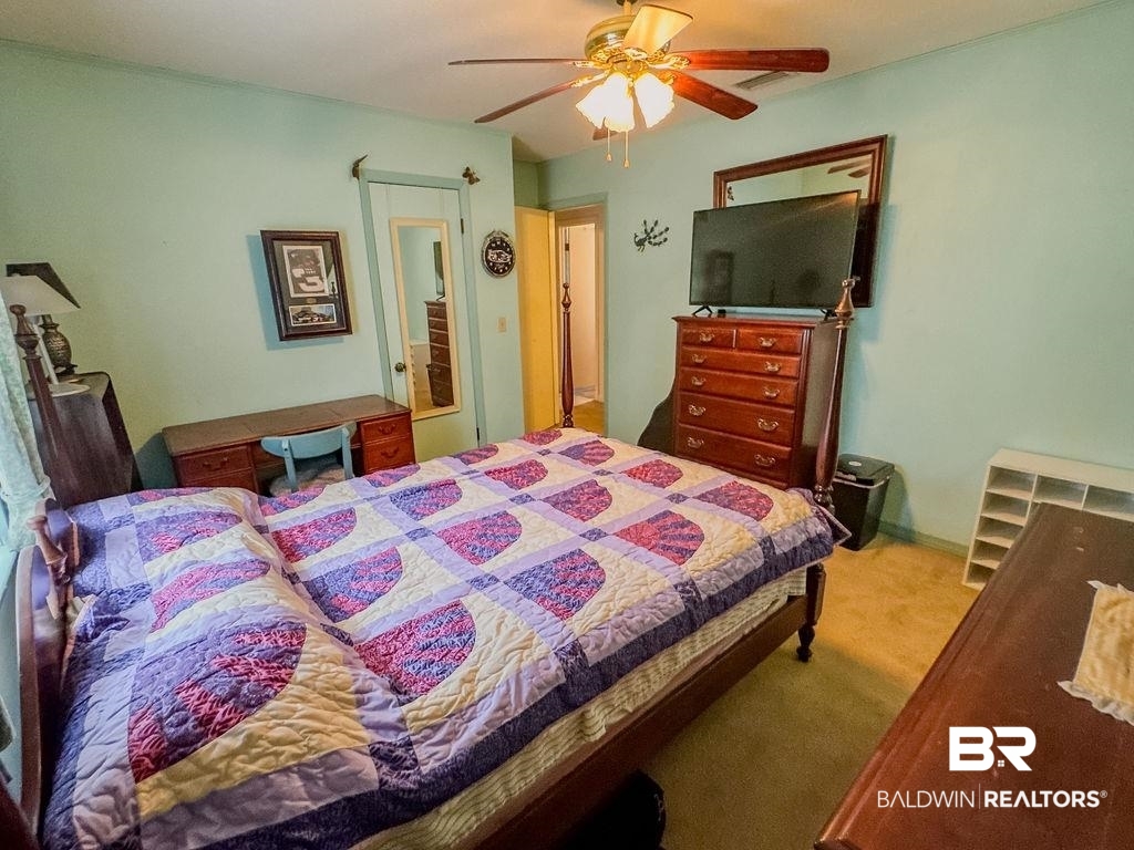 1456 Allen Walker Road Grove Hill, AL 36451 - Photo 18 of 28 Bedroom featuring carpet flooring and a ceiling fan