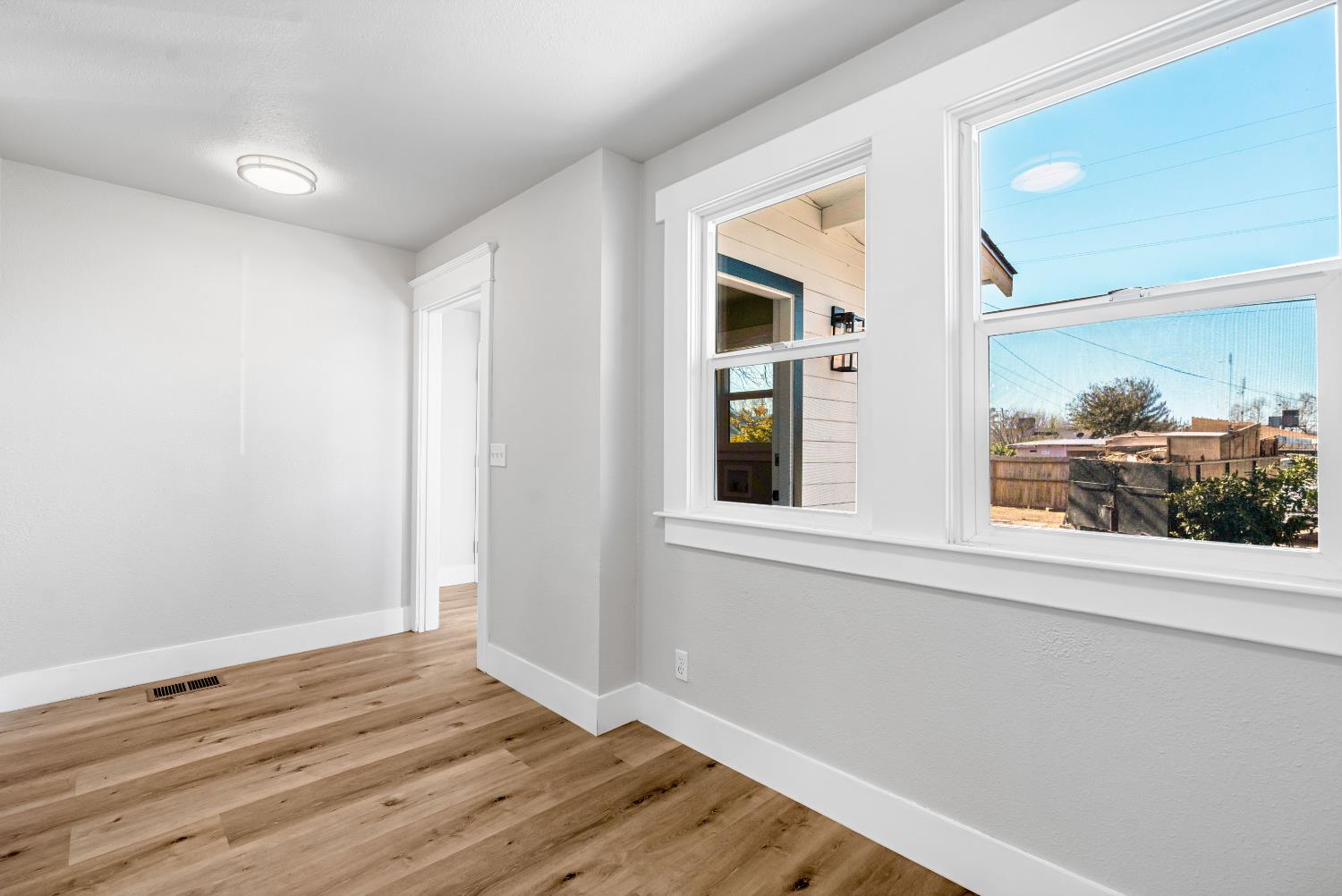 1249 D Street Reedley, CA 93654 - Photo 15 of 40 a view of a room that has a window in it