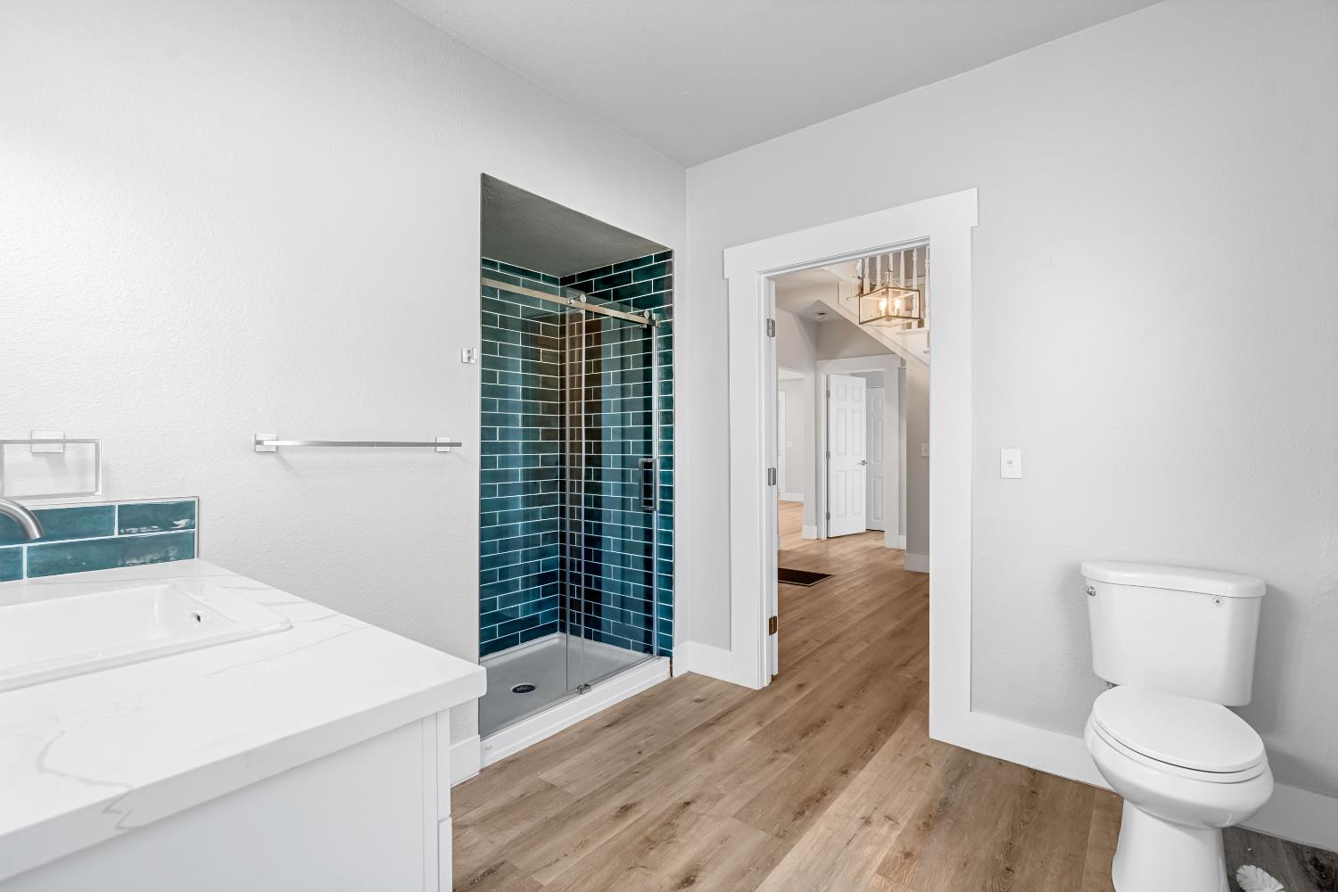 1249 D Street Reedley, CA 93654 - Photo 21 of 40 a bathroom with a sink a toilet and shower