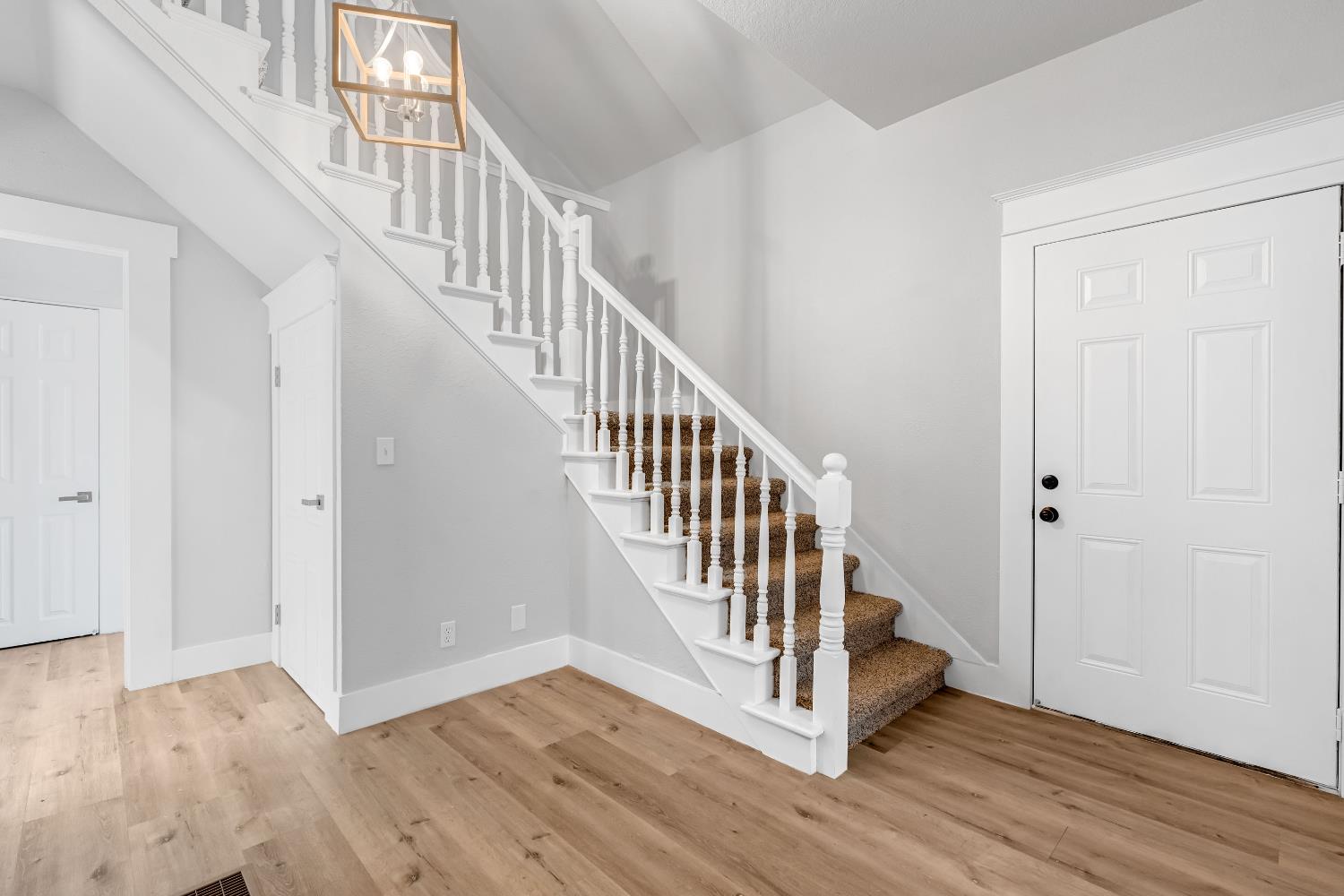 1249 D Street Reedley, CA 93654 - Photo 25 of 40 a view of a hallway with wooden floor and entryway