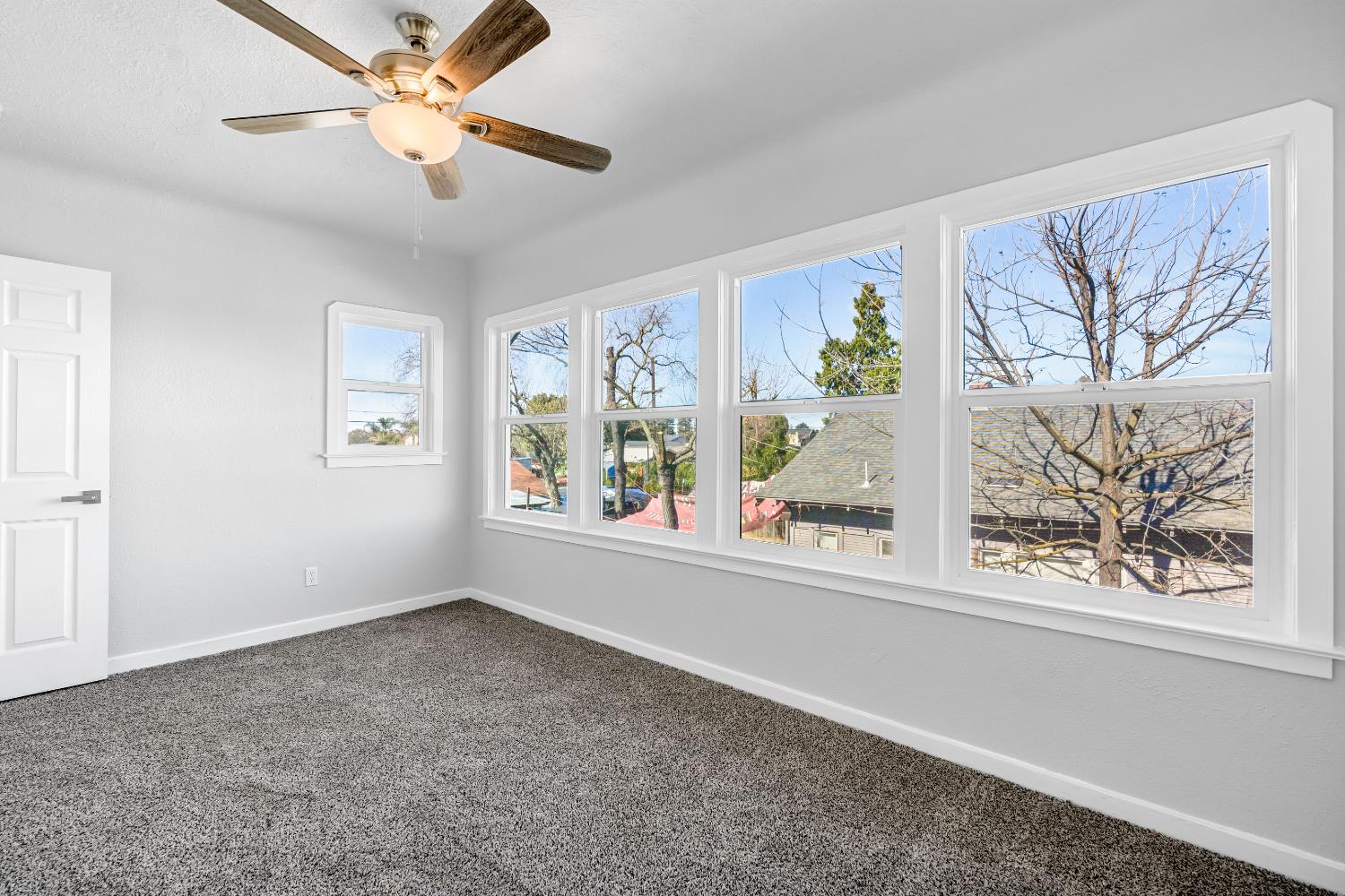 1249 D Street Reedley, CA 93654 - Photo 30 of 40 wooden floor in an empty room with a window