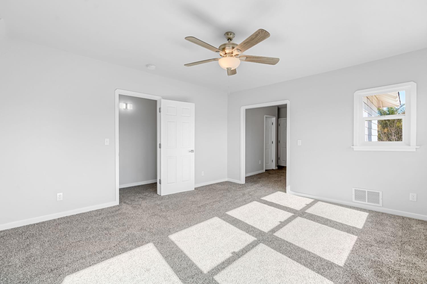 1249 D Street Reedley, CA 93654 - Photo 32 of 40 a view of an empty room with a window