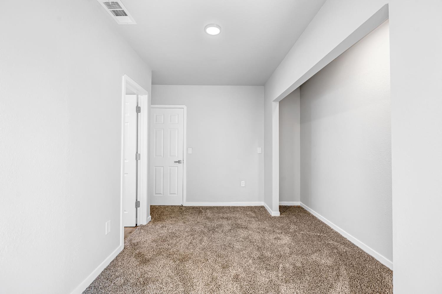 1249 D Street Reedley, CA 93654 - Photo 33 of 40 an empty room with a natural light