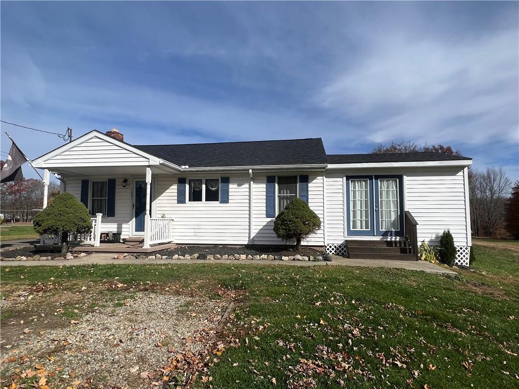 1061 Rutledge Road Transfer, PA 16154 - Photo 1 of 23 a front view of a house with a yard