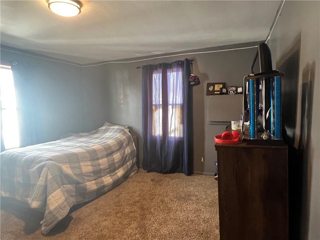 1061 Rutledge Road Transfer, PA 16154 - Photo 21 of 23 a bedroom with a bed and large mirror