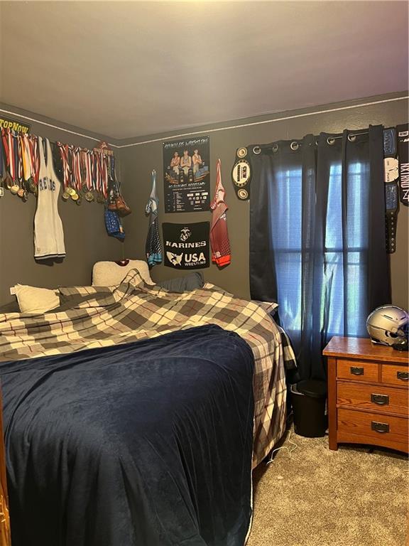 1061 Rutledge Road Transfer, PA 16154 - Photo 23 of 23 a bed sitting in a bedroom next to a cabinet