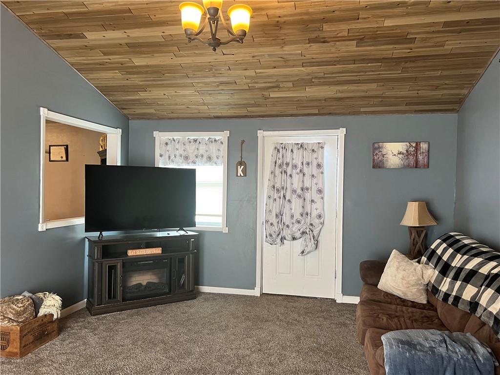 1061 Rutledge Road Transfer, PA 16154 - Photo 8 of 23 a living room with furniture and a flat screen tv