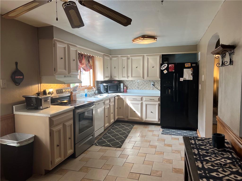 1061 Rutledge Road Transfer, PA 16154 - Photo 10 of 23 a kitchen with a sink window and cabinets
