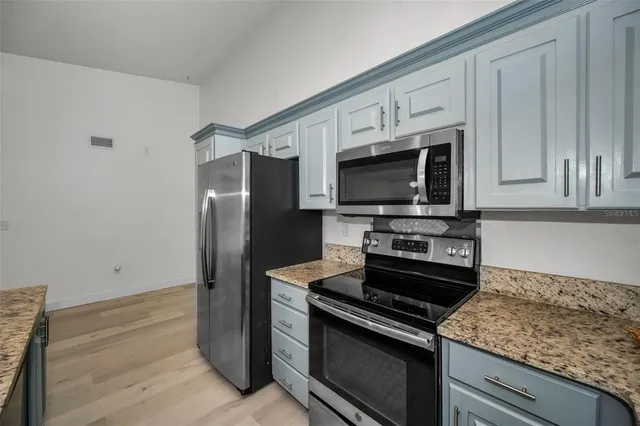 a view of a refrigerator in kitchen and a refrigerator