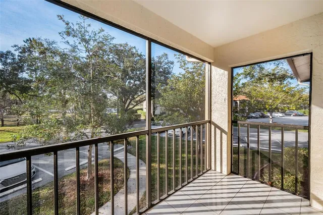 a view of a balcony with wooden floor