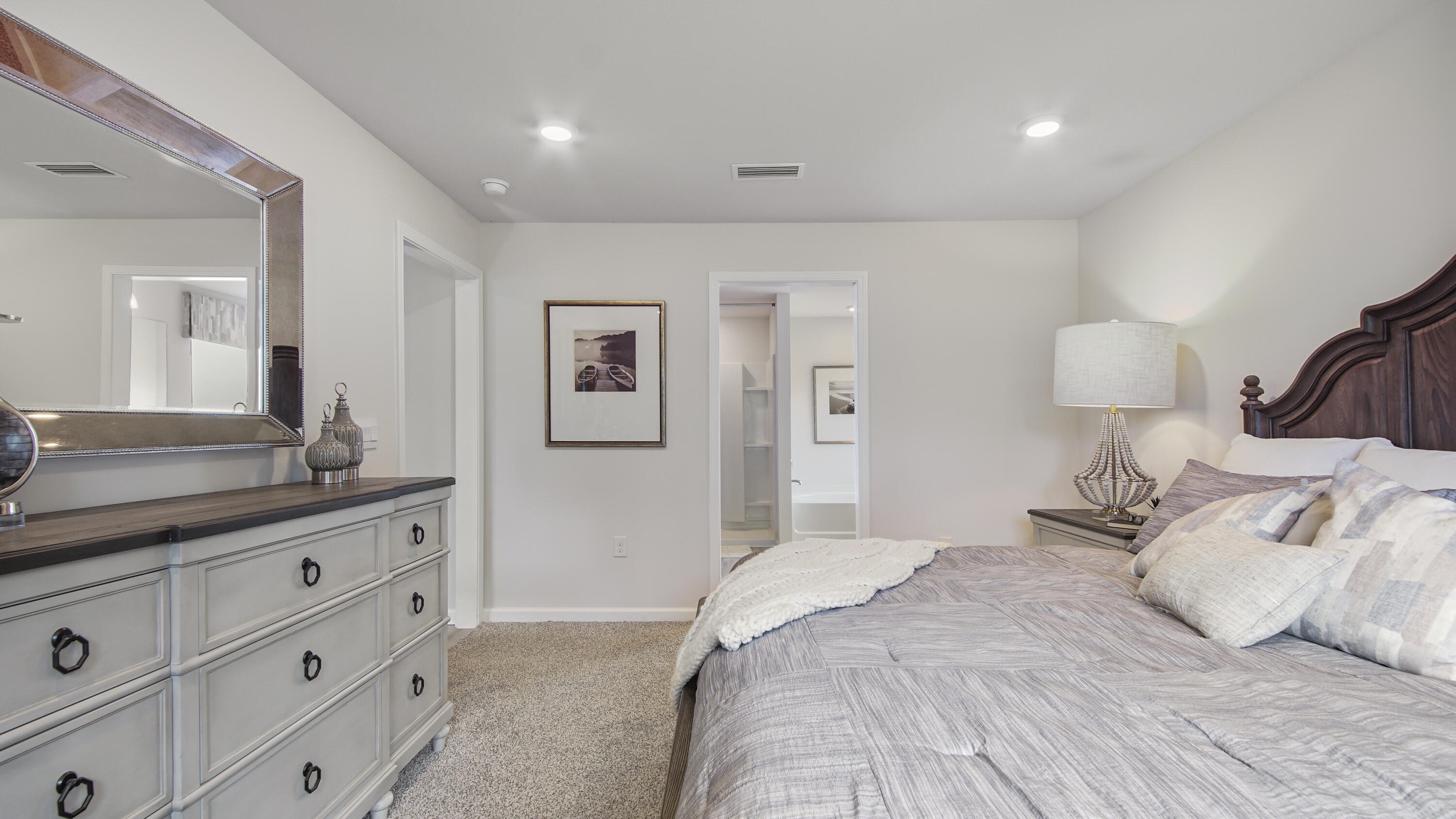 204 Gray Owl Drive Freeport, FL 32439 - Photo 15 of 35 a bedroom with a bed and a lamp