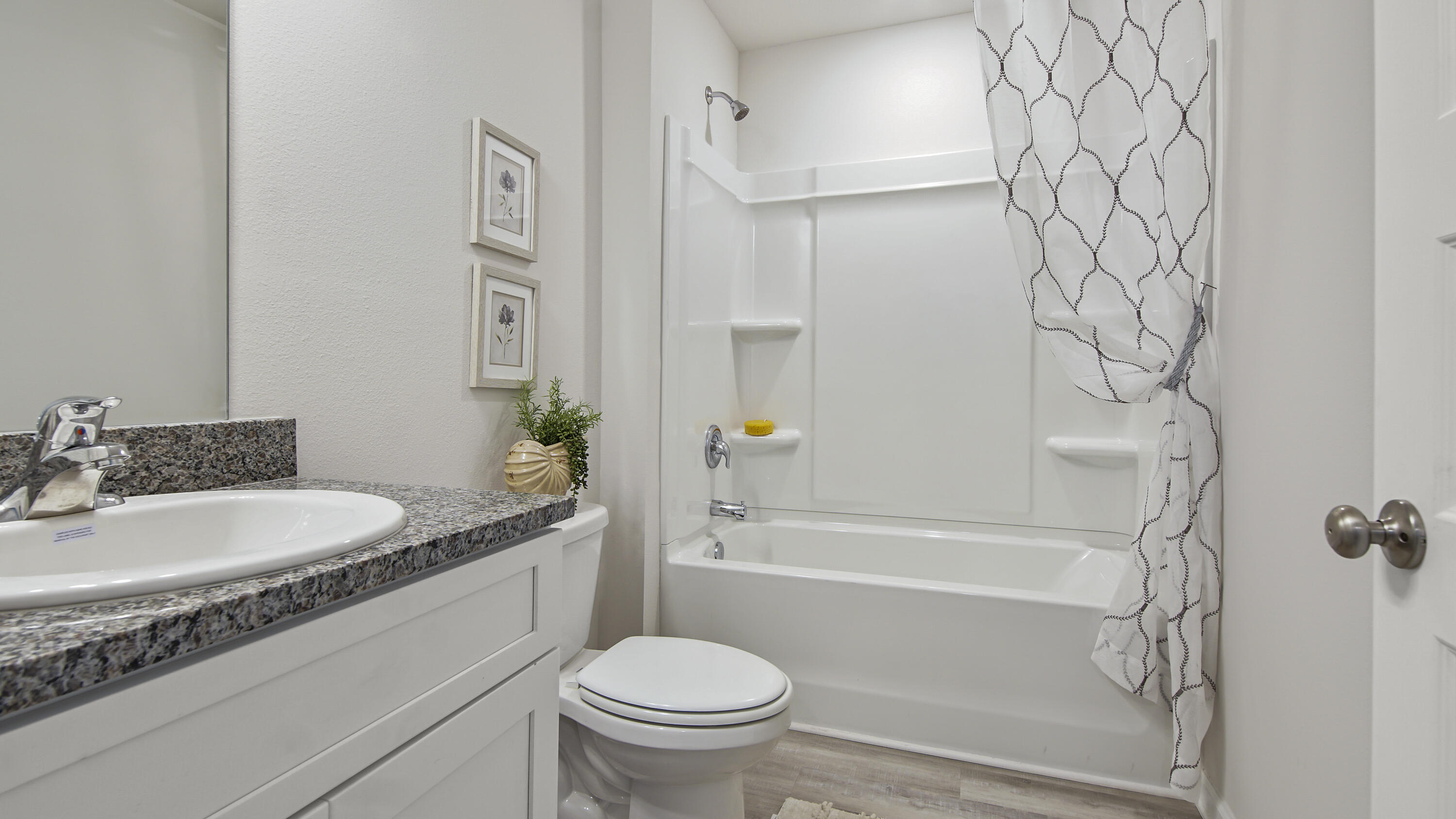 204 Gray Owl Drive Freeport, FL 32439 - Photo 25 of 35 a bathroom with a granite countertop sink toilet and shower