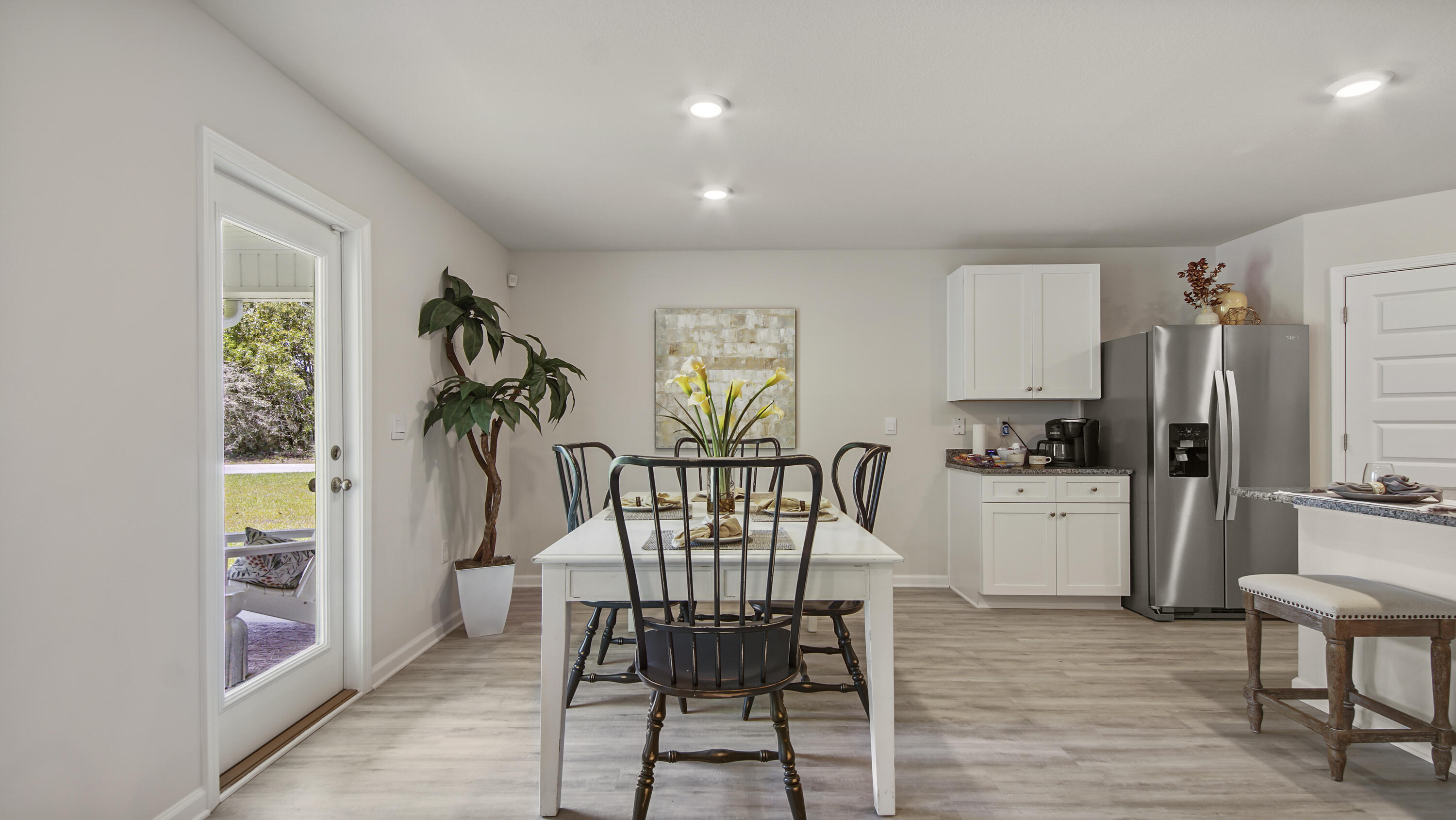 204 Gray Owl Drive Freeport, FL 32439 - Photo 6 of 35 a view of a dining room with furniture and a kitchen