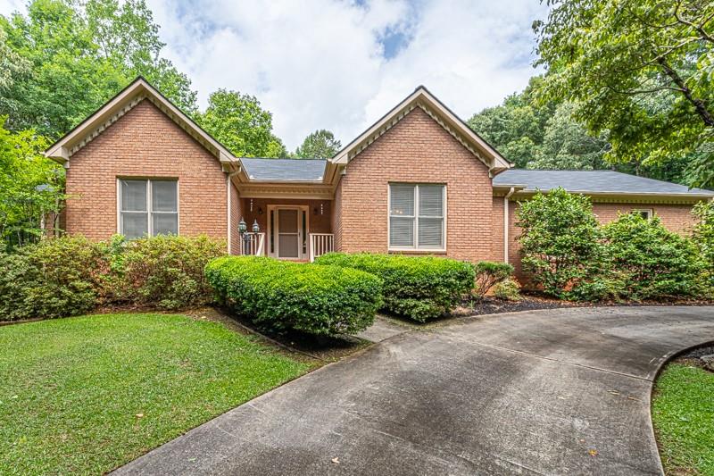 224 Snead Road Fayetteville, GA 30215 - Photo 1 of 1 a front view of house with yard and green space