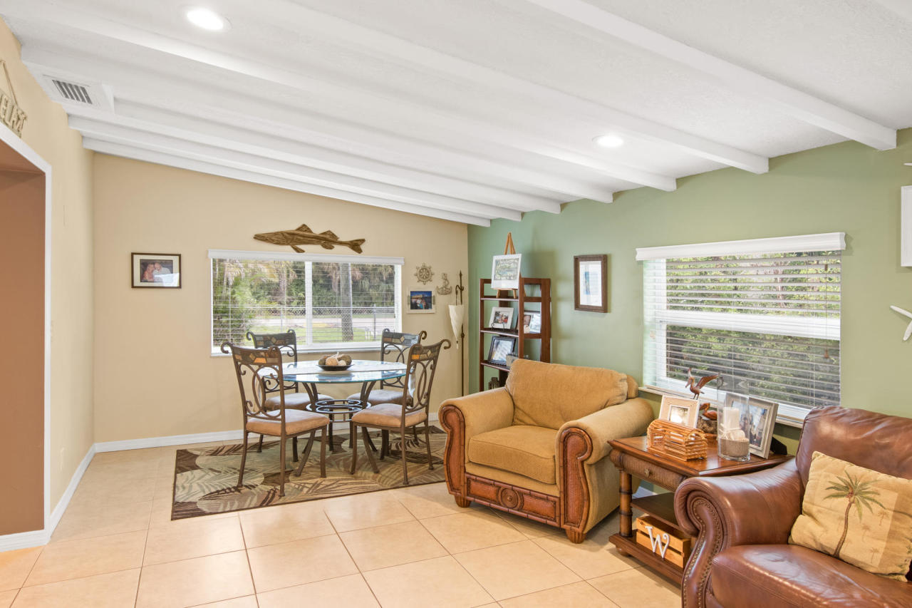 5768 Sullivan Road Jupiter, FL 33458 - Photo 16 of 18 a living room with furniture and a large window