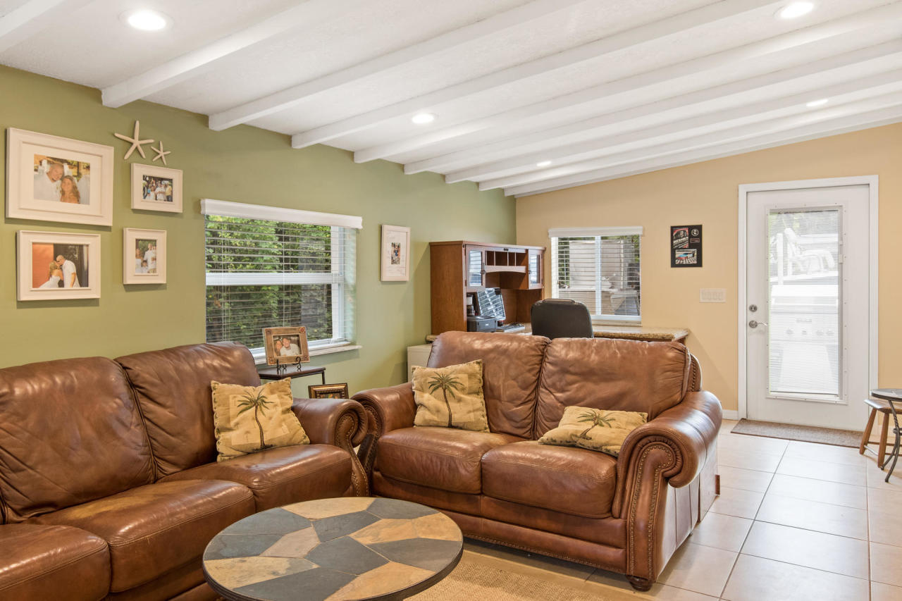 5768 Sullivan Road Jupiter, FL 33458 - Photo 17 of 18 a living room with furniture and a window