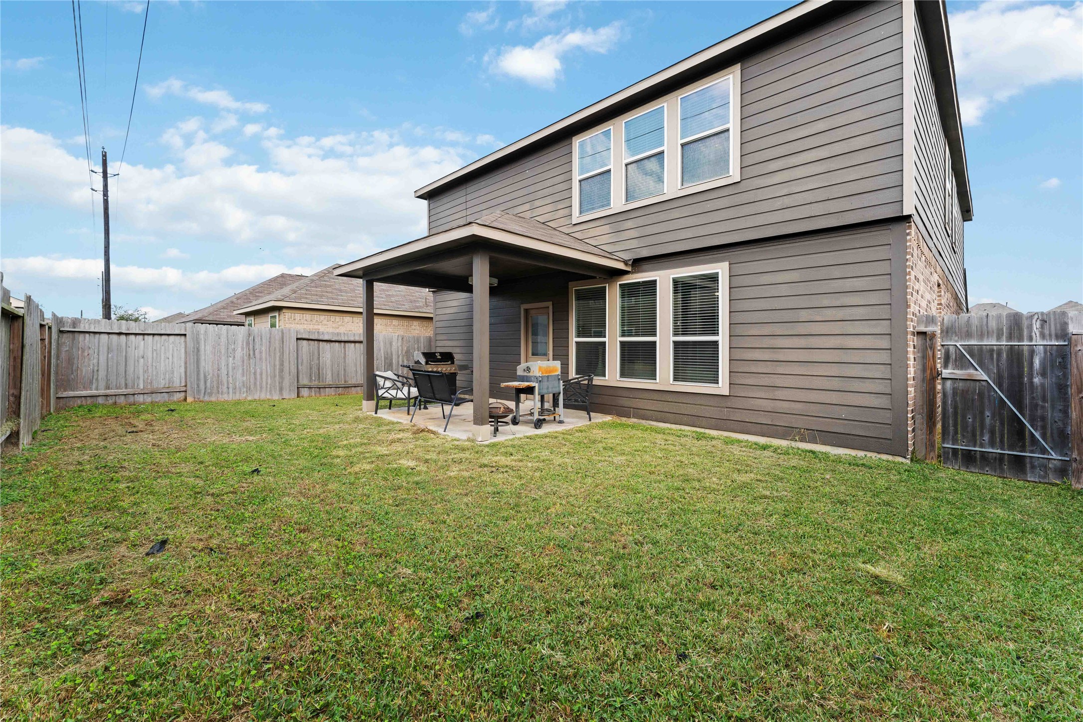 14810 Ruddy Duck Lane Houston, TX 77049 - Photo 30 of 33 a backyard of a house with table and chairs