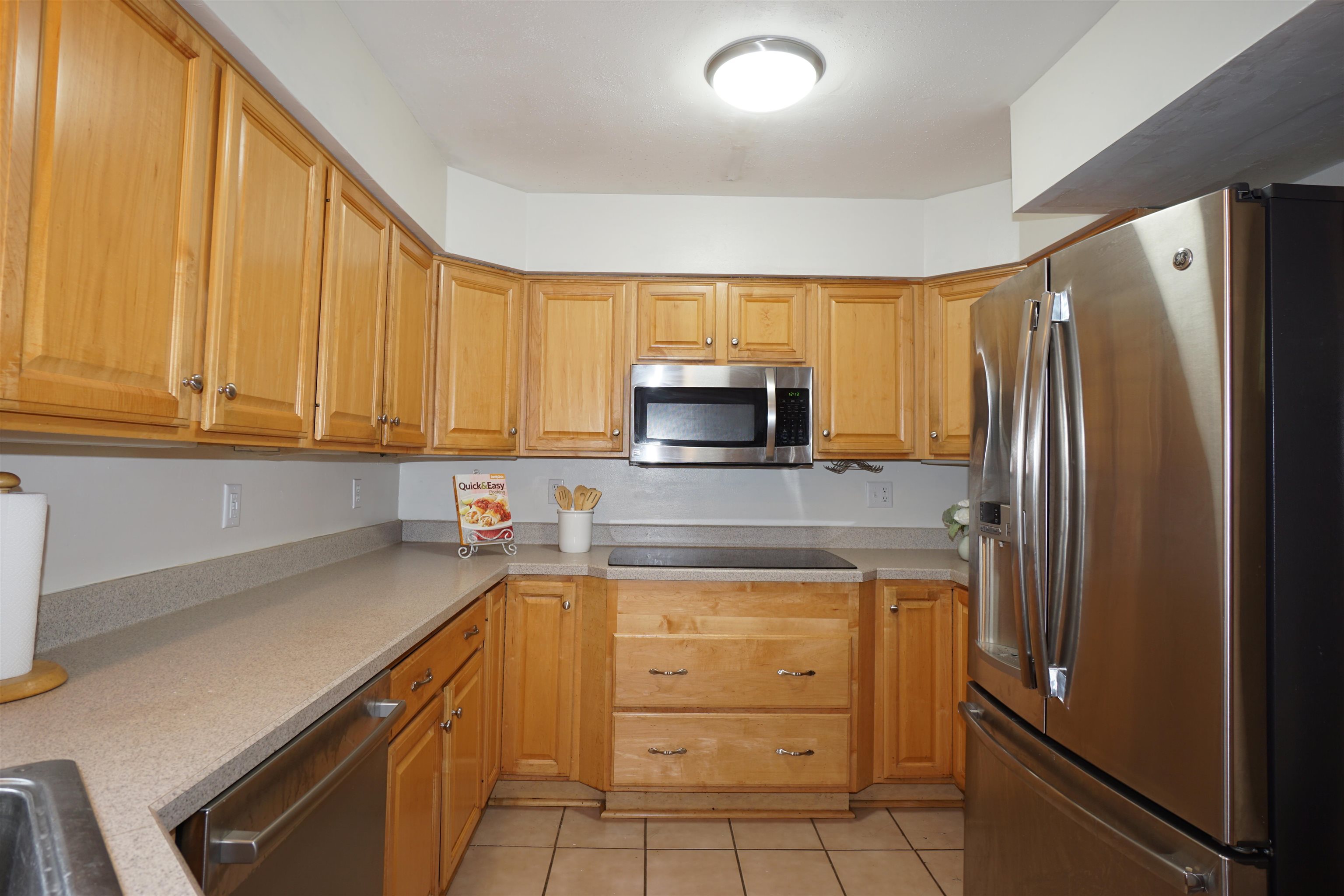 4819 Highcrest Road Rockford, IL 61107 - Photo 11 of 31 a kitchen with a refrigerator sink and cabinets