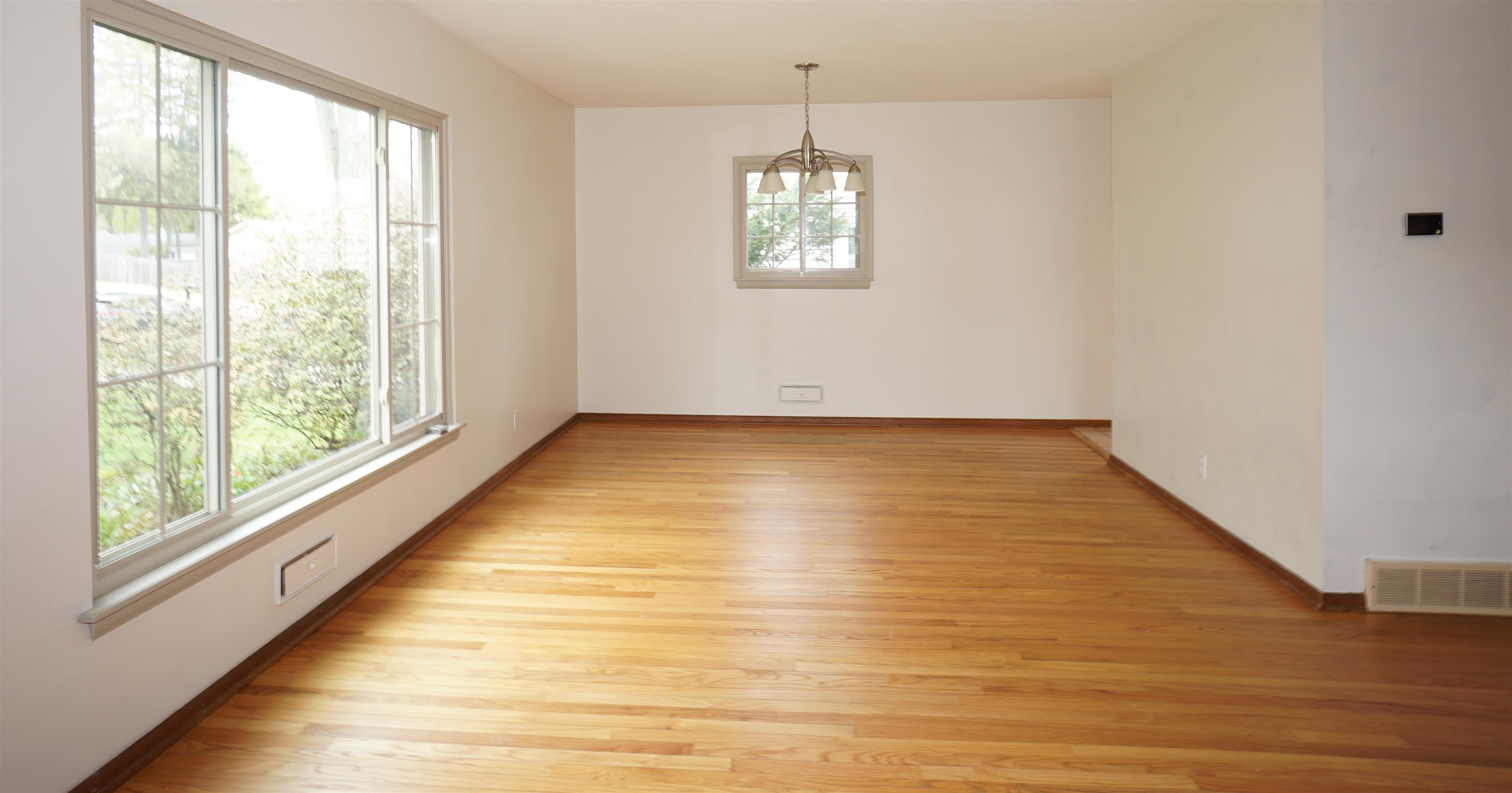 4819 Highcrest Road Rockford, IL 61107 - Photo 8 of 31 a view of empty room with wooden floor and fan