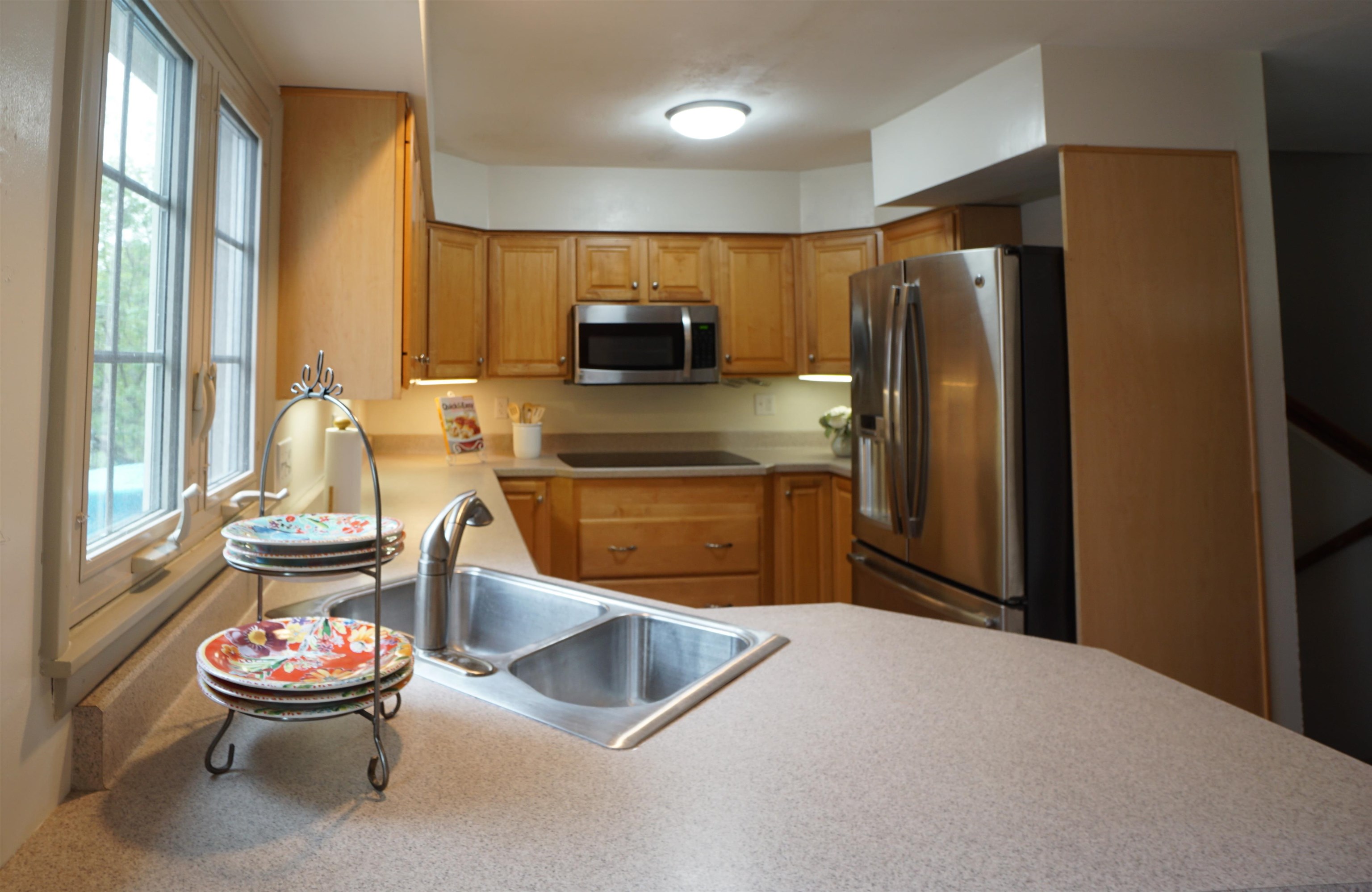 4819 Highcrest Road Rockford, IL 61107 - Photo 10 of 31 a kitchen with a refrigerator and a stove