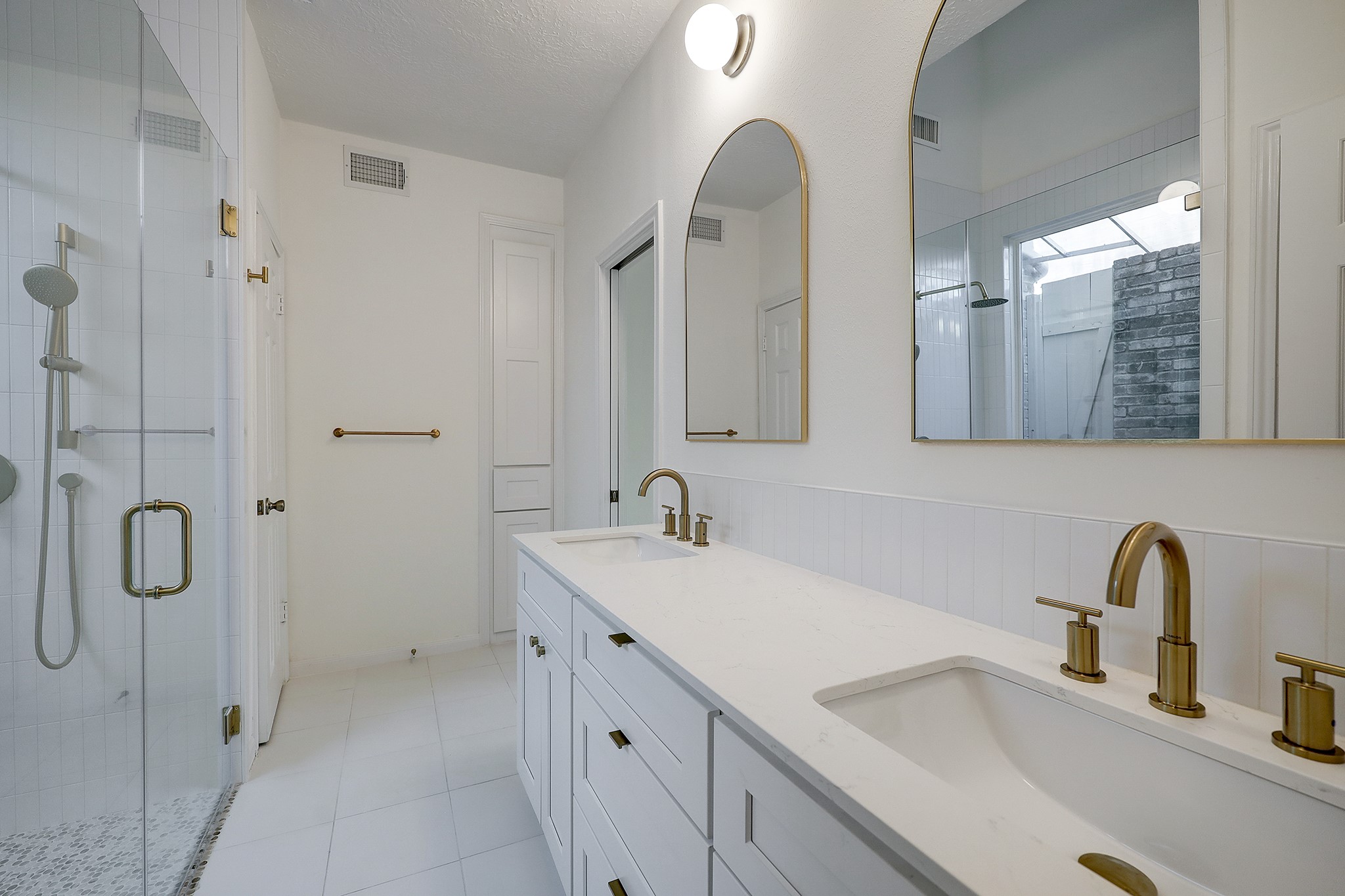 4311 Westheimer Road Houston, TX 77027 - Photo 13 of 23 a bathroom with a sink and a mirror
