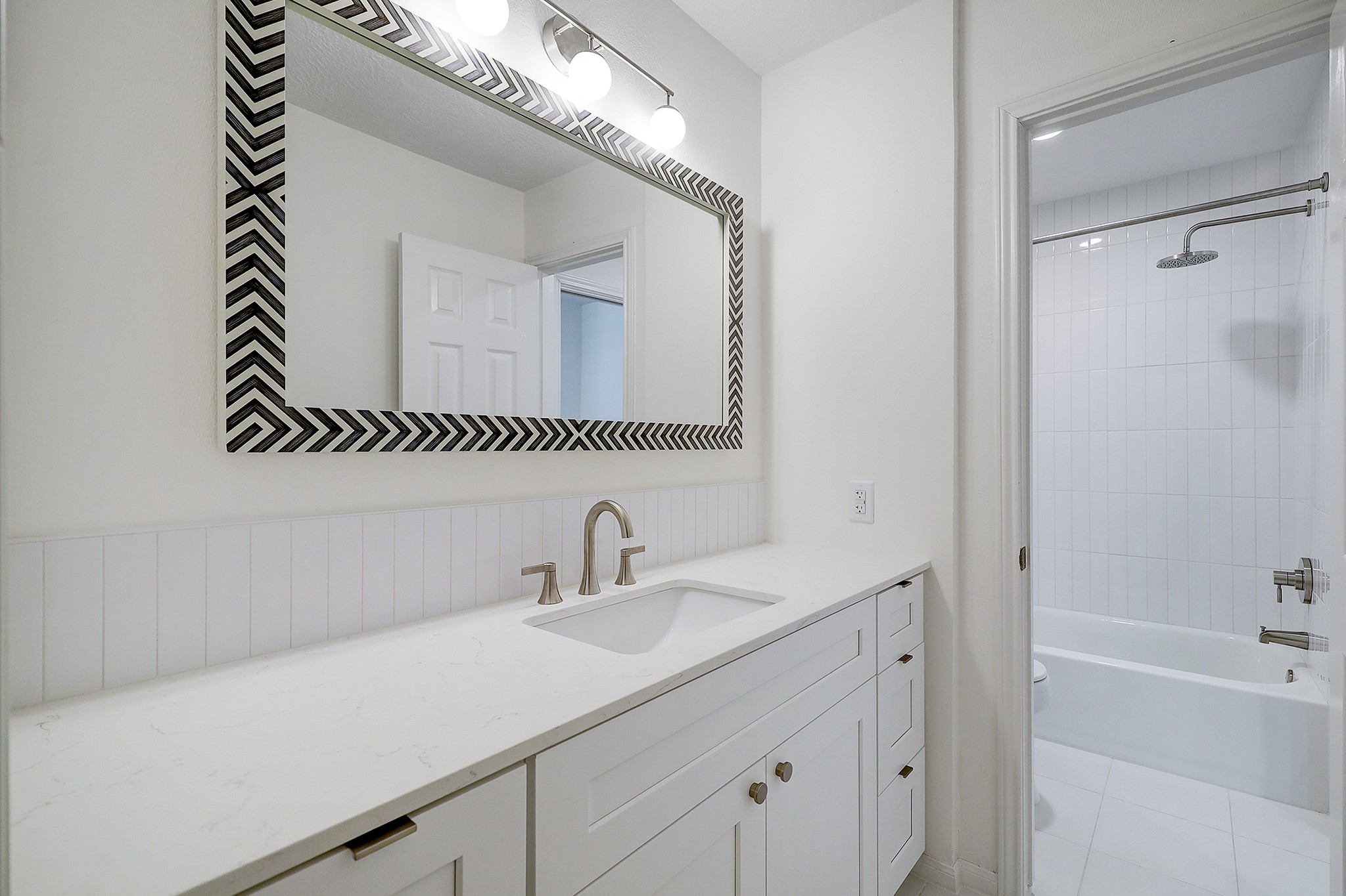 4311 Westheimer Road Houston, TX 77027 - Photo 17 of 23 a bathroom with a sink and a mirror