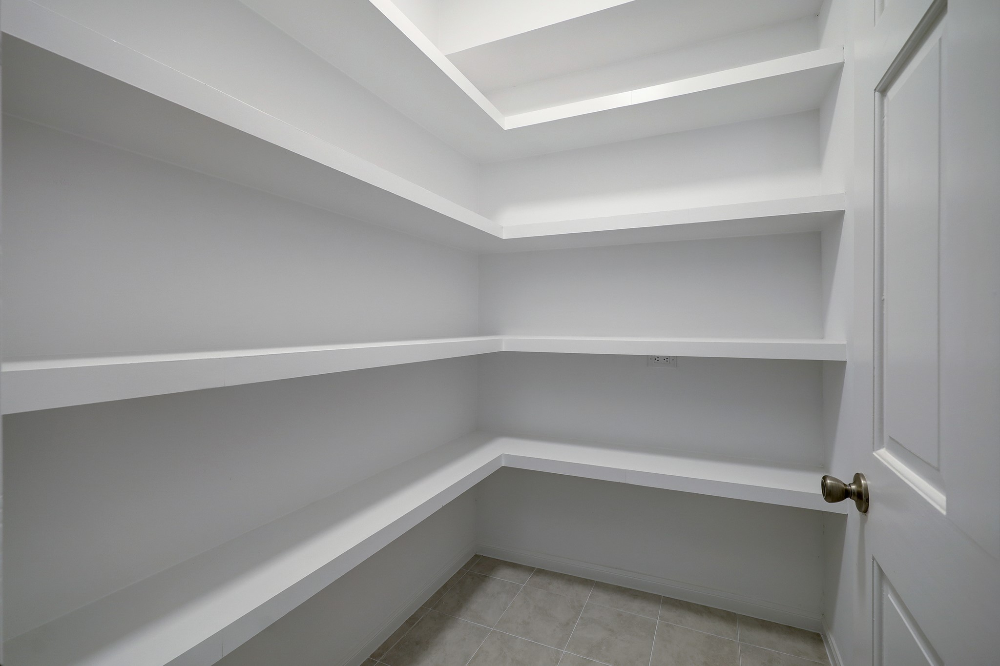 4311 Westheimer Road Houston, TX 77027 - Photo 9 of 23 a storage room with empty racks